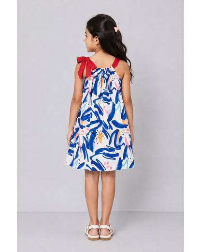 Pillowcase dress with red bow tie