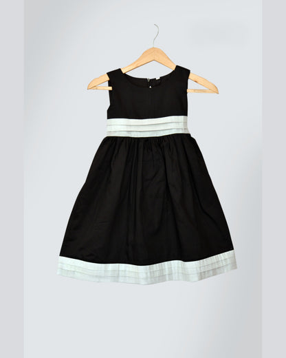 Black dress with White stripes at waist and bottom hemline