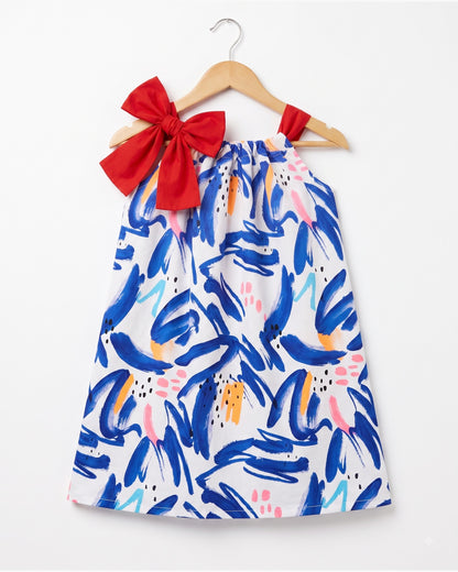 Pillowcase dress with red bow tie